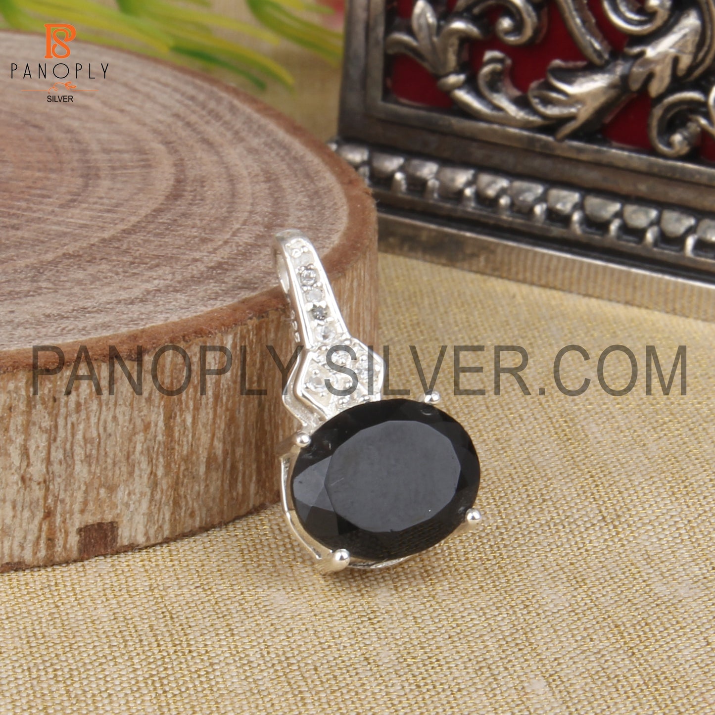 Oval Black Onyx And White Topaz Studded Halo Pendant