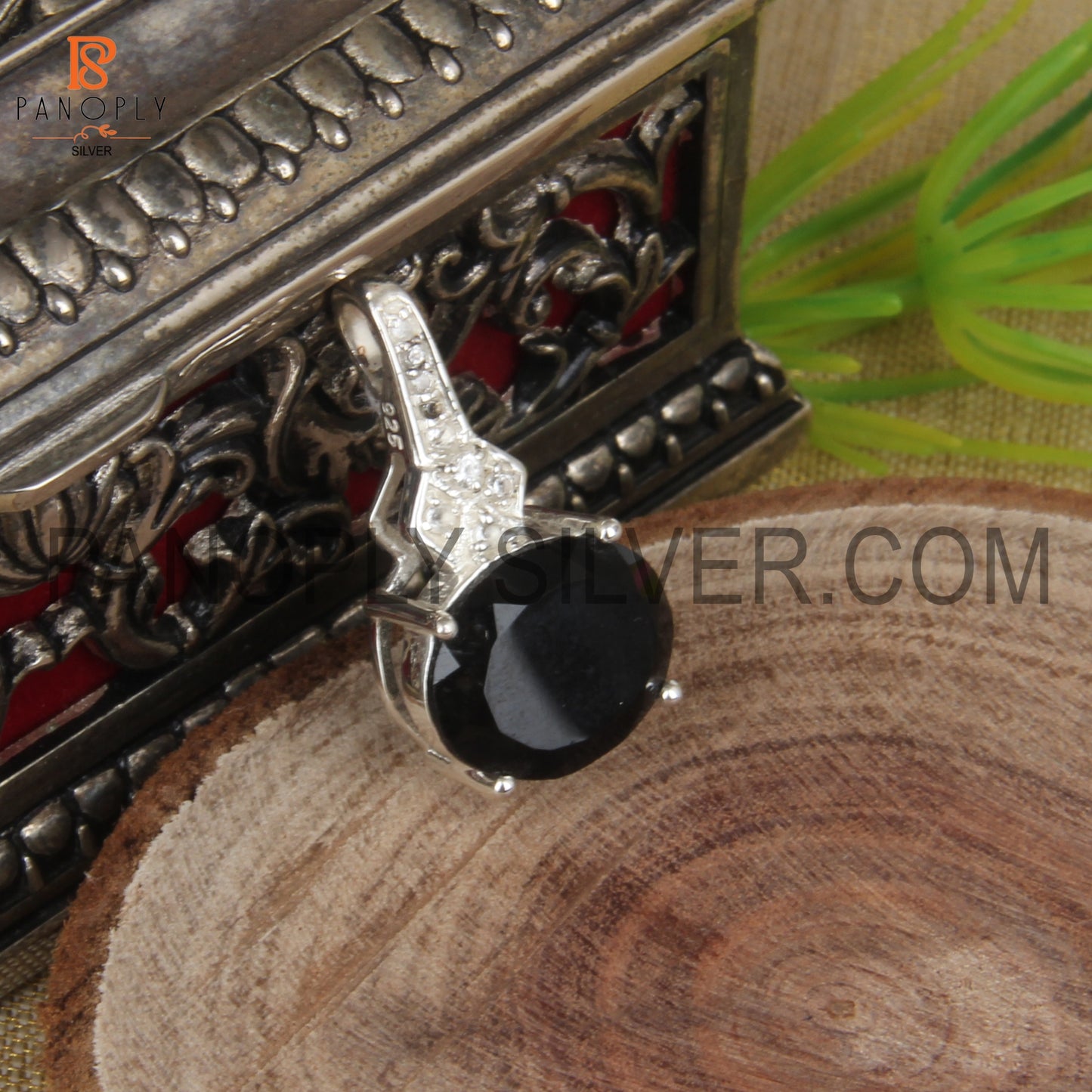 Oval Black Onyx And White Topaz Studded Halo Pendant