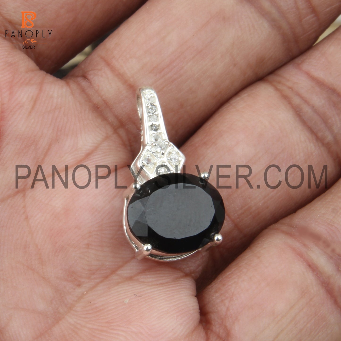 Oval Black Onyx And White Topaz Studded Halo Pendant